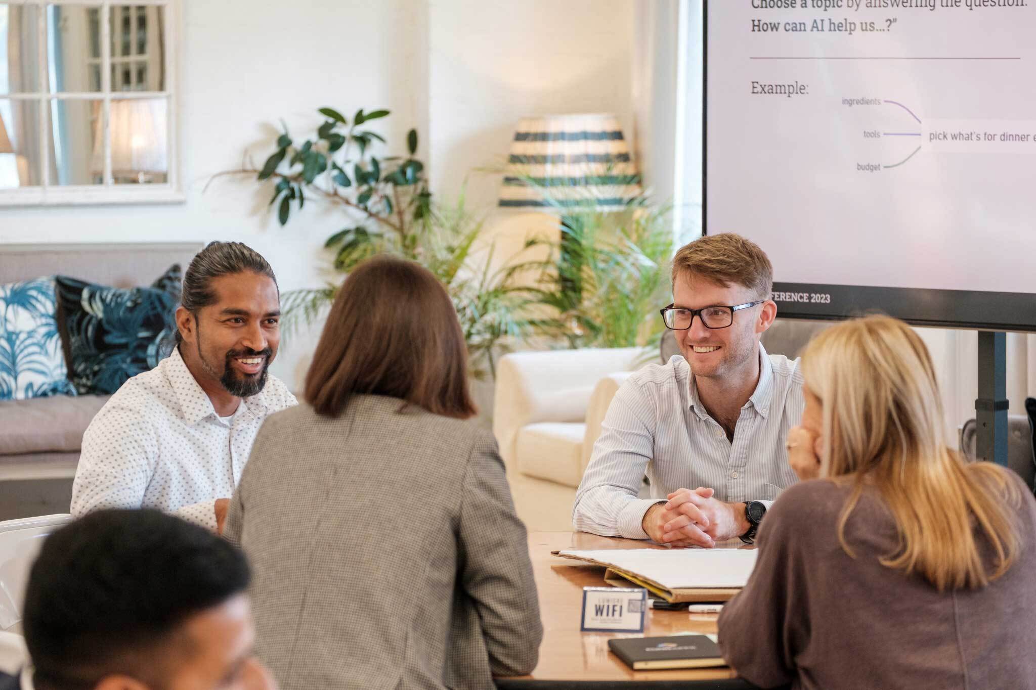 At FundApps, we always have a seat at the table to offer support. Our clients admire our unwavering resilience and ability. Team around a table. 