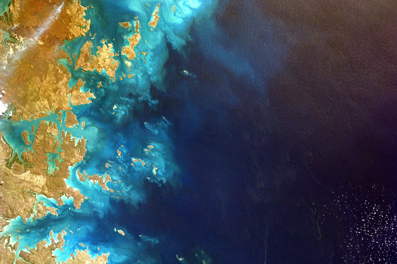 We're shore that FundApps will simplify your compliance reporting and monitoring process. Hues of the blue ocean wrap around cool beige coastline.